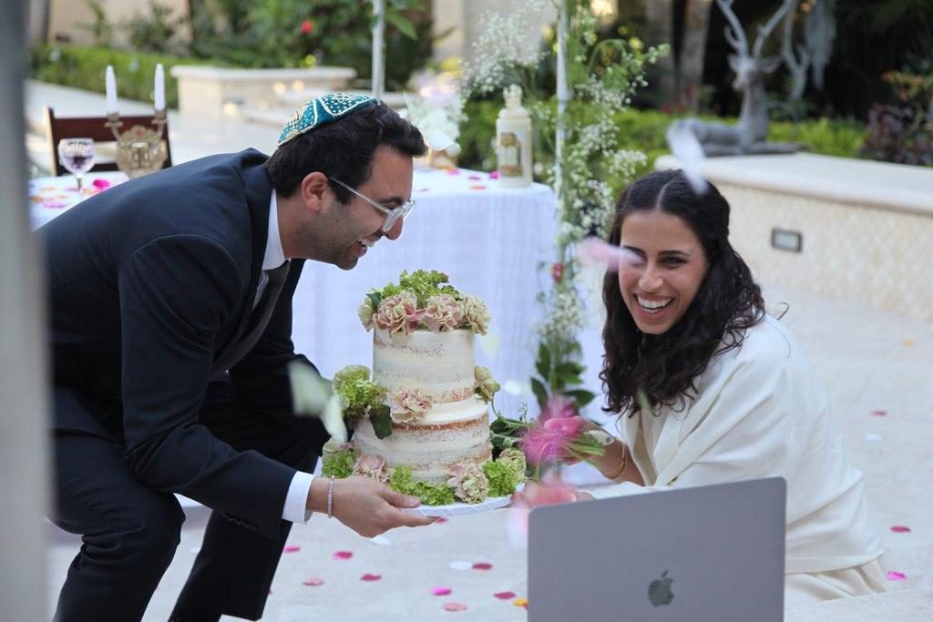 show off their wedding cake to their virtual guests